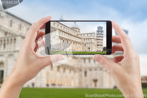 Image of Female Hands Holding Smart Phone Displaying Photo of The Leaning