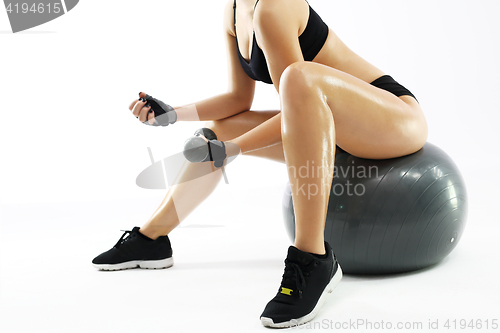 Image of Fitness woman exercising abdominal muscles 