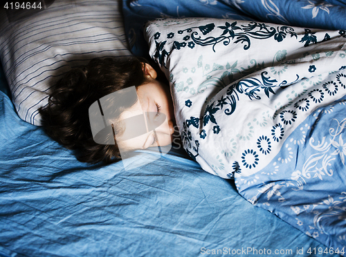 Image of little cute kid sleeping at night, lifestyle people concept