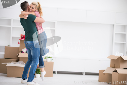 Image of happy Young couple moving in new house