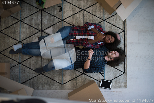 Image of Top view of attractive young multiethnic couple