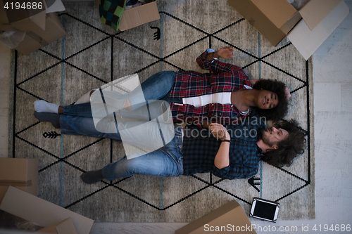 Image of Top view of attractive young multiethnic couple