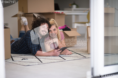 Image of Young couple moving in a new flat