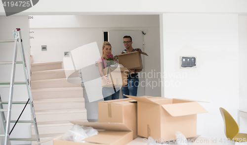 Image of young couple moving into a new home