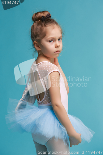 Image of The little balerina dancer on blue background