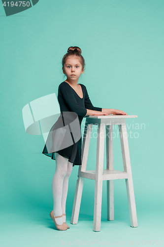 Image of The little balerina dancer on blue background