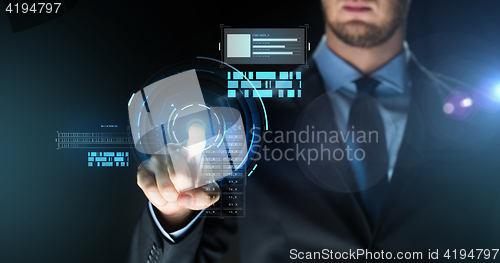 Image of businessman touching virtual screen projection