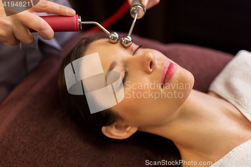 Image of woman having hydradermie facial treatment in spa