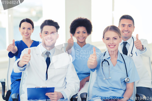 Image of group of happy doctors on seminar at hospital