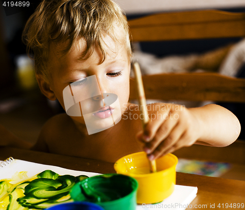 Image of little cute boy painting at home, lifestyle people concept