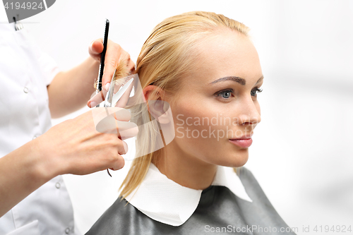 Image of Barber haircut woman in a hair salon 