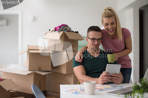 Image of Young couple moving in a new home