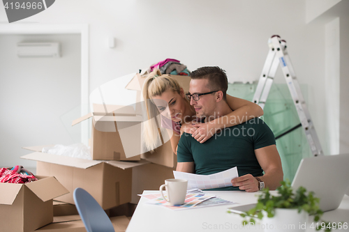 Image of Young couple moving in a new home