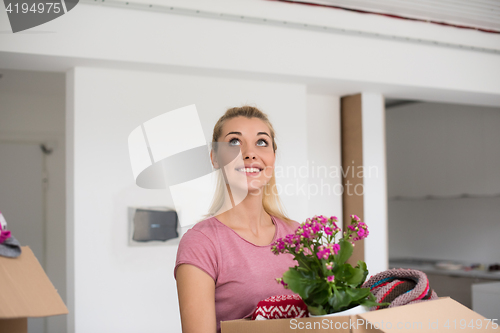 Image of girl moving in the new apartment