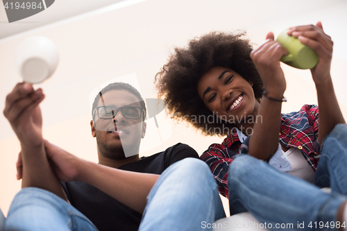 Image of couple having break during moving to new house