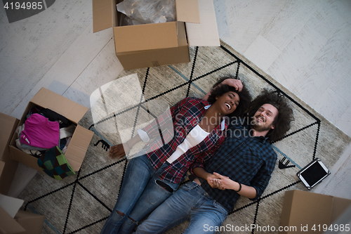 Image of Top view of attractive young multiethnic couple