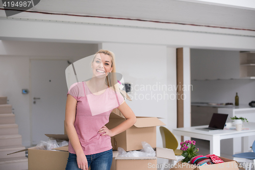 Image of girl moving in the new apartment