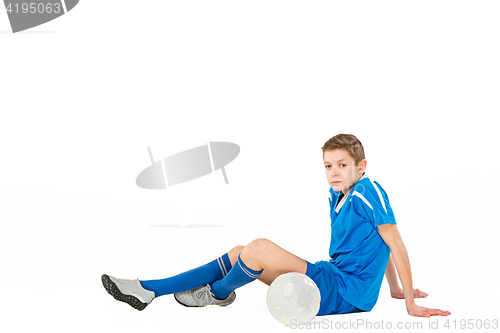 Image of Young boy with soccer ball