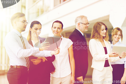 Image of business people with tablet pc computers at office