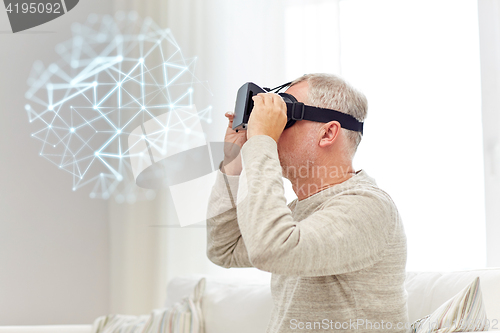 Image of old man in virtual reality headset or 3d glasses