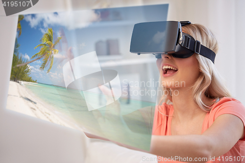 Image of woman with virtual reality headset over beach
