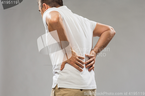 Image of close up of man suffering from backache