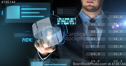 Image of businessman touching virtual screen projection