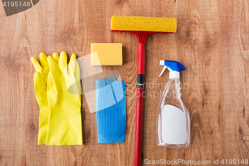 Image of swab with cleaning stuff on wooden background