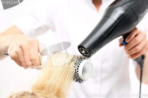 Image of Combing the hair drying brush