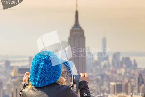 Image of Woman enjoying in New York City panoramic view.