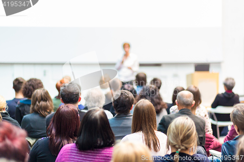 Image of Woman giving presentation on business conference.