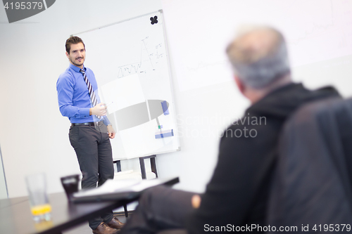 Image of Job interview - businessman listen to candidate answers.