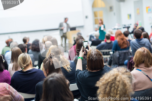 Image of Man giving presentation in lecture hall at university.