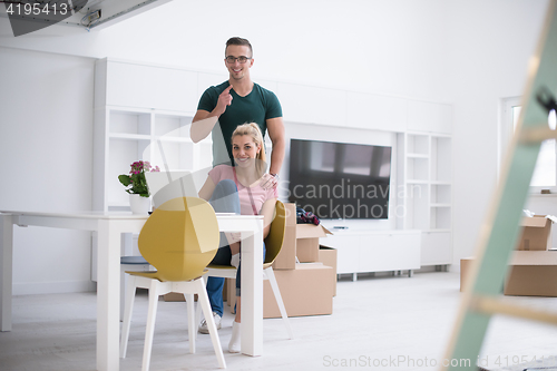 Image of Young couple moving in a new home