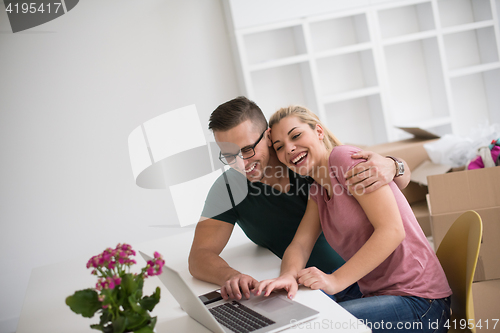 Image of Young couple moving in a new home