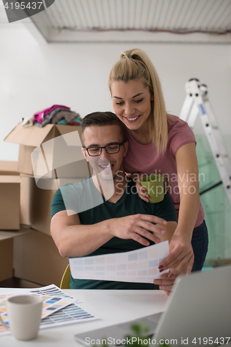 Image of Young couple moving in a new home