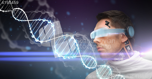 Image of man with 3d glasses, sensors and dna molecule