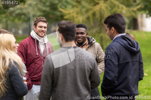 Image of group of happy international friends outdoors
