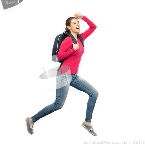 Image of happy woman or student with backpack jumping