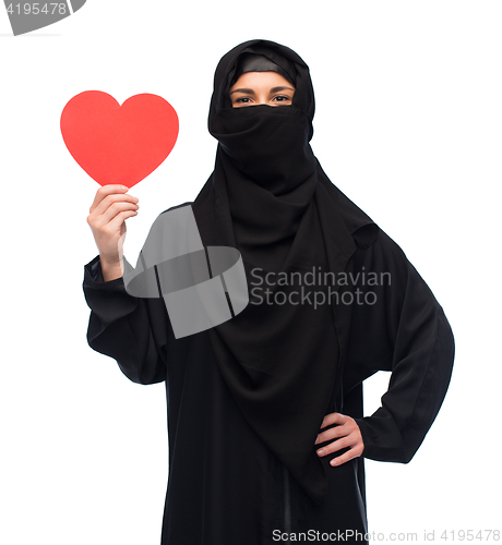 Image of muslim woman in hijab holding red heart