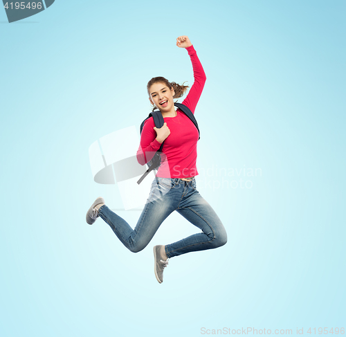 Image of happy woman or student with backpack jumping