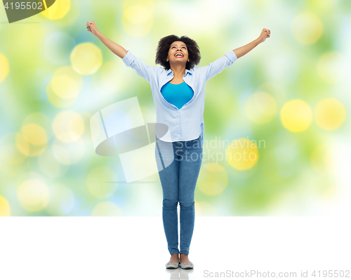 Image of happy african american young woman over white