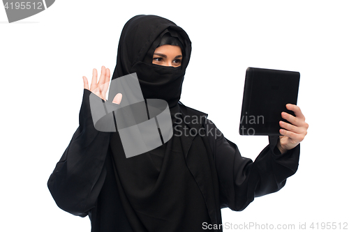 Image of muslim woman in hijab with tablet pc computer