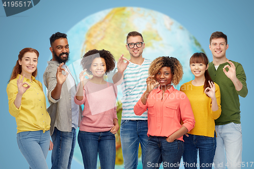 Image of international group of happy people showing ok