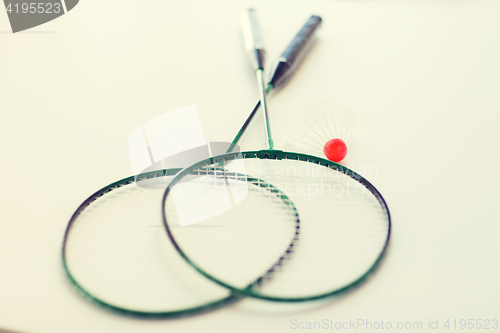 Image of close up of badminton rackets with shuttlecock