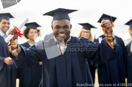 Image of happy student with diploma celebrating graduation