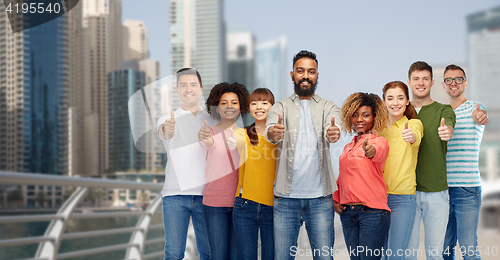 Image of group of people showing thumbs up  in dubai