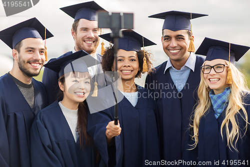 Image of students or bachelors taking selfie by smartphone