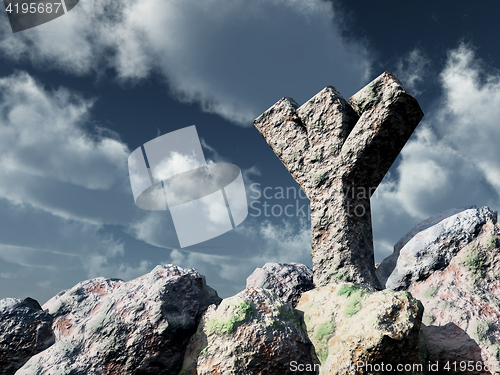 Image of rune rock under cloudy blue sky - 3d illustration