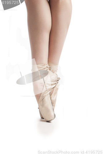 Image of legs in pointe ballerina on white background